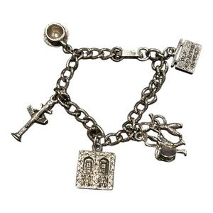 Vintage NOLA silver tone charm bracelet room for more charms. Charms in pics. YM